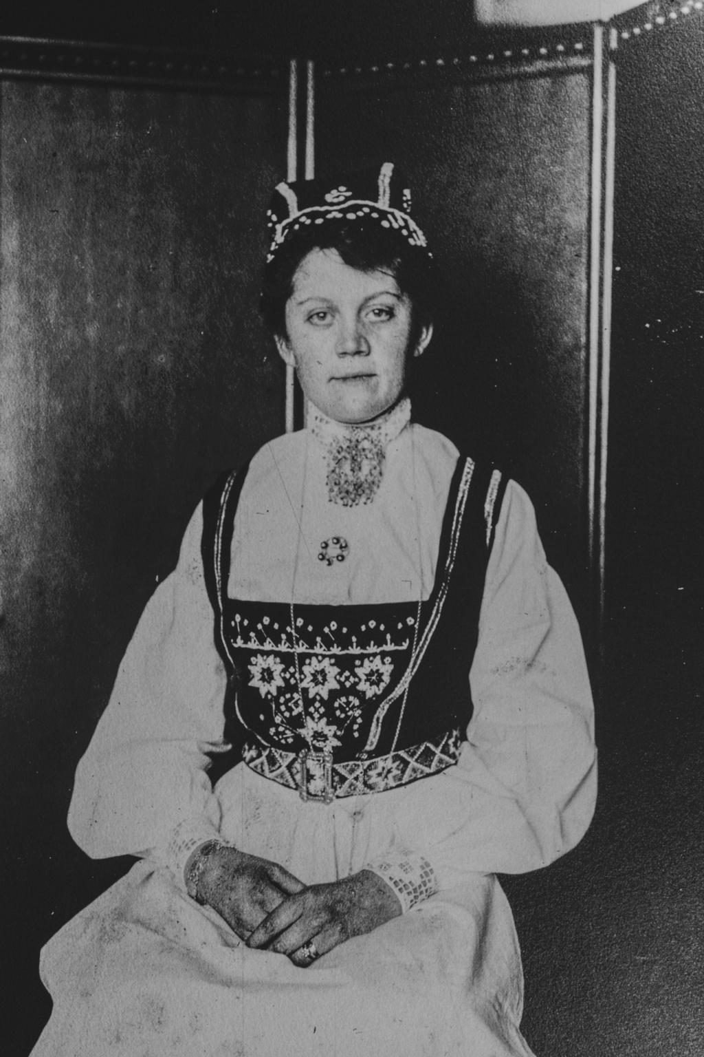 A Norwegian woman, wearing a crown